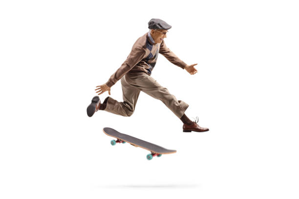 istock Energetic elderly man jumping with a skateboard 1202275916