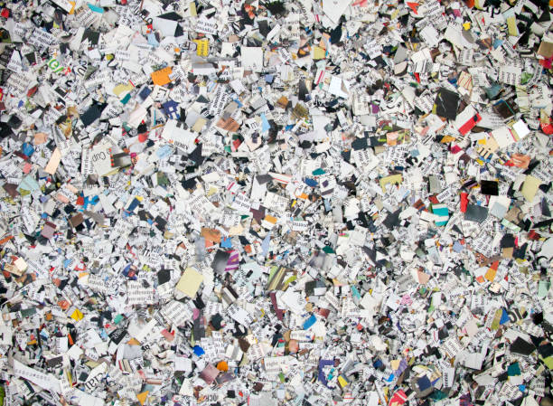 istock Newspaper confetti from above with the word 1202278543