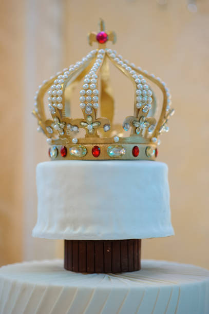 istock Wedding cake with luxury decorated in wedding party. Cake decorated with crown 1202278754