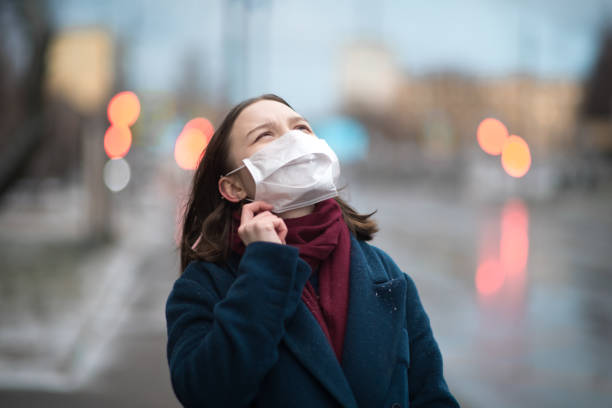 istock Young girl wearing a protective face mask 1202284628