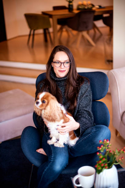 istock Young woman with her cute puppy 1202284679