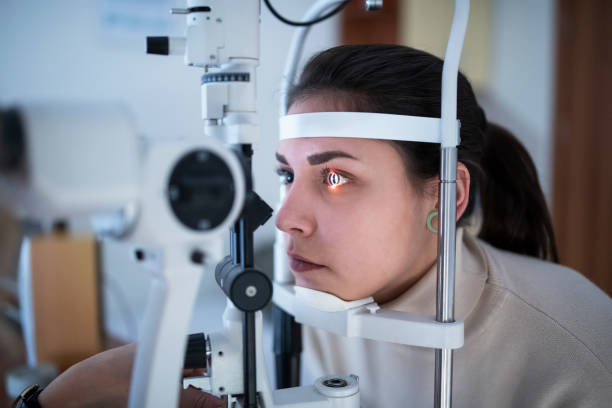istock Female patient having eye tested in hospital 1202286628