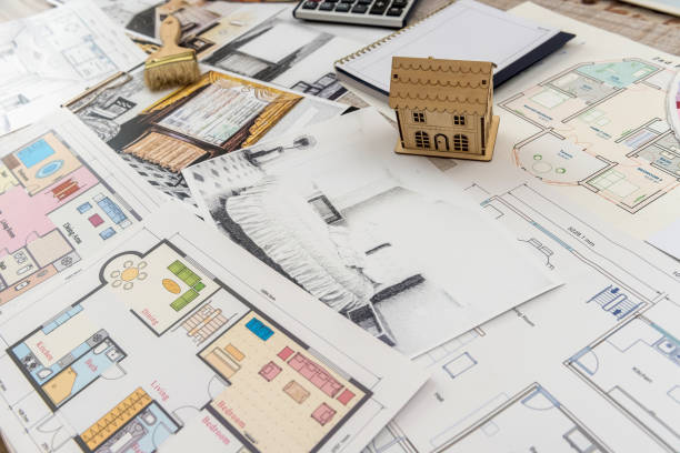 istock architect work - drawing sketch plans blueprints with color palette for help 1202289691