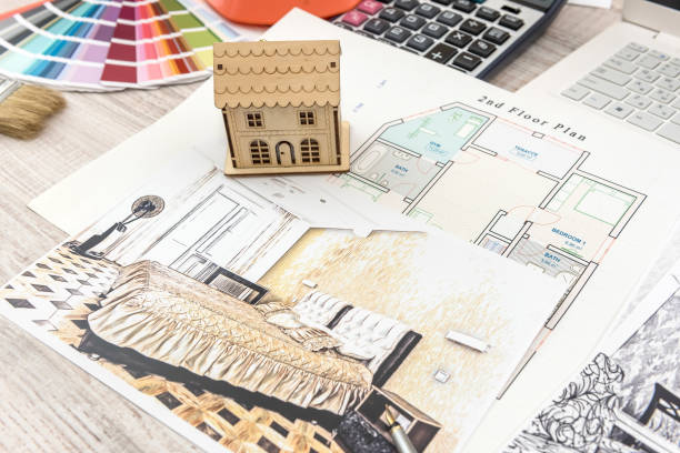istock architect work - drawing sketch plans blueprints with color palette for help 1202289881