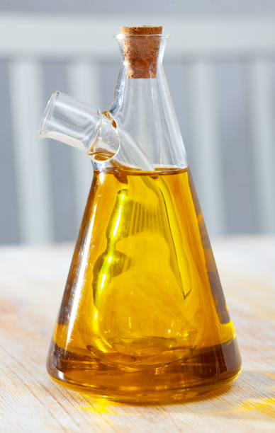 istock Vegetable oil on wooden table 1202290026