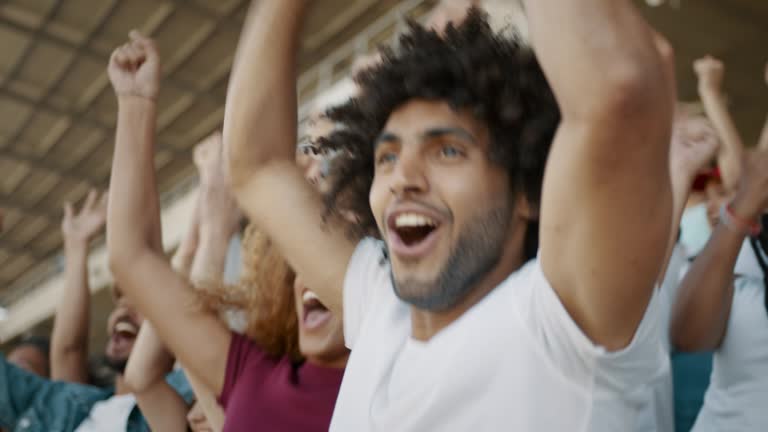 Excited fans celebrating their team's victory