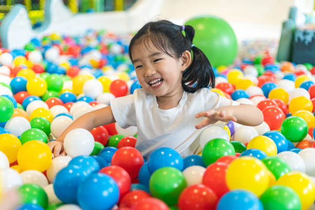 istock Cute girl at the Ball Pool 1202290236