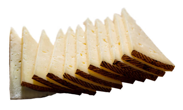 istock Semi-hard cheese on wooden surface 1202290625