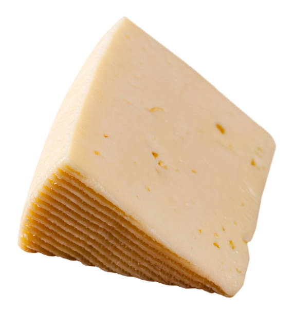 istock Slice of semi-soft cheese on a wooden table 1202290638