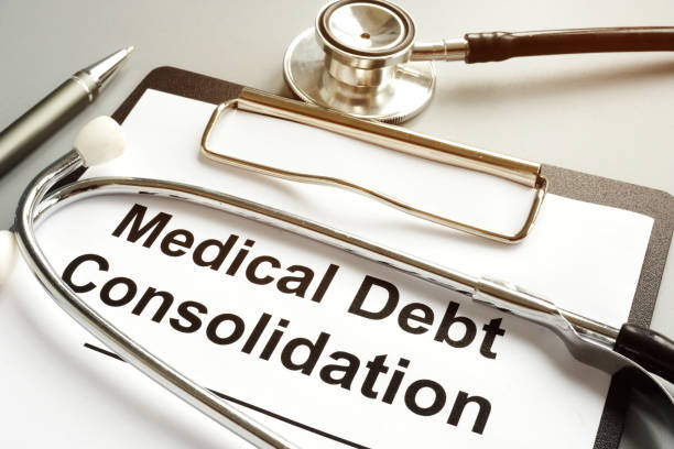istock Medical debt consolidation form and stethoscope. 1202291596