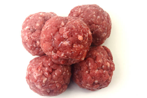 istock closeup fresh raw meatballs beef isolated over white background 1202292717