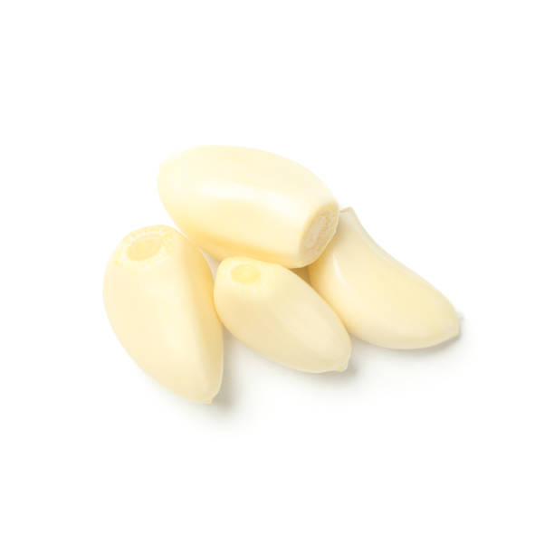 istock Fresh garlic slices isolated on white background, top view 1202294274