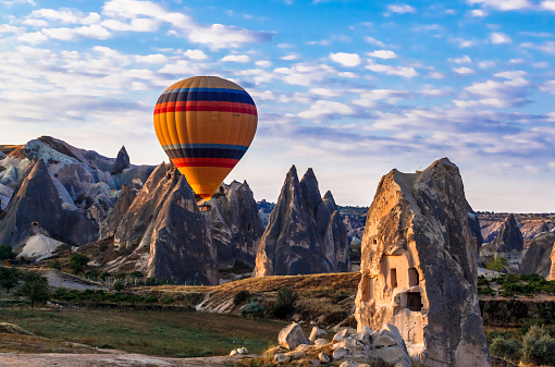 Colorful hot air balloon flying in the valley at Cappadocia