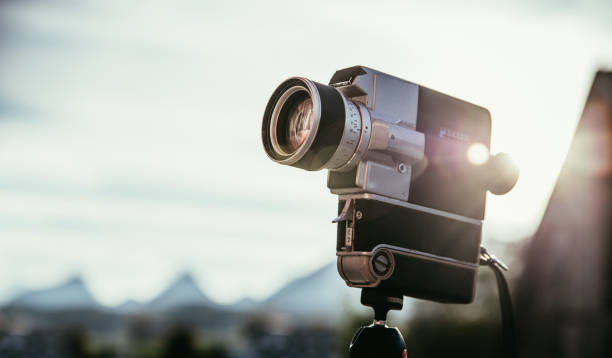 istock Vintage old movie camera, outdoors, sunset 1202296973