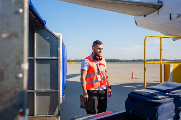 istock Airport service crew controlling luggage 1202299639