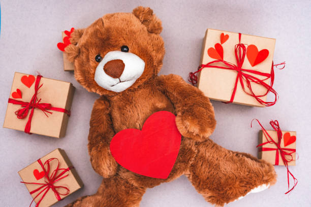 istock Teddy Bear with red heart and gift box. Valentines Day creative greeting card. 1202300023