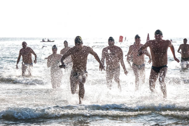 Valencia, Spain; 09 28 2019: Swimmers from the open water crossing 'Clara Morales' run towards the finish