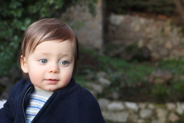 istock One year old baby smiling outdoors 1202305891