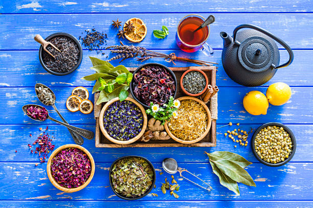 istock Herbal tea: various dried tea leaves and flowers shot from above on blue table 1202307108