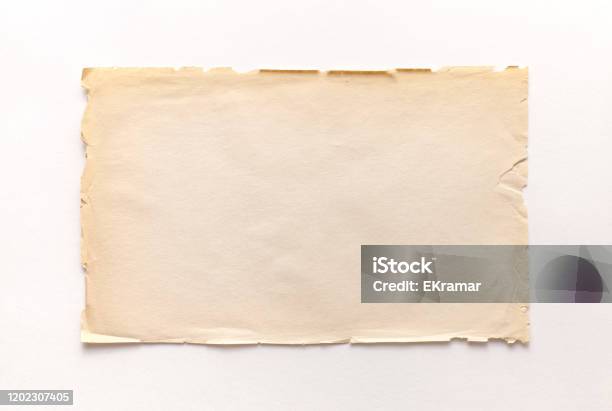 Old Rough Recycled Paper With Ragged Edges On A White Background With A Shadow Stock Photo - Download Image Now