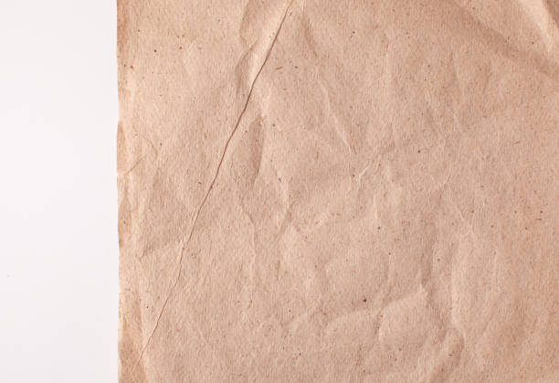 istock Crumpled recycled paper with a torn edge on a white background 1202307426