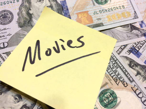 American cash money and yellow post it note with text Movies American cash money and yellow post it note with text Movies in black color aerial view philadelphia federal reserve stock pictures, royalty-free photos & images