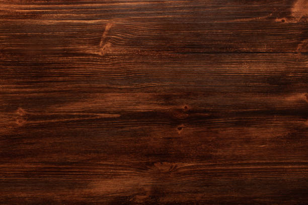 istock Background texture of old dark brown wood with defects 1202309208