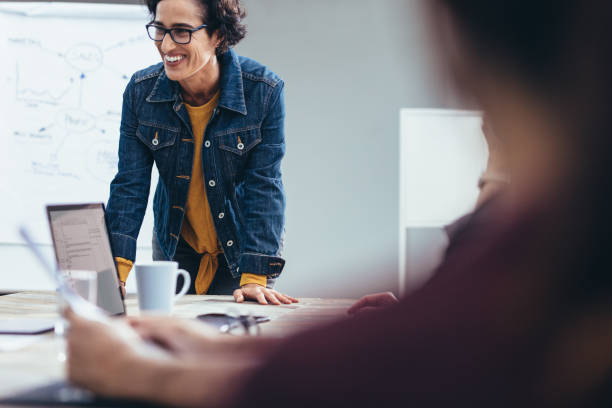 istock Smiling female professional during a meeting in office 1202309894