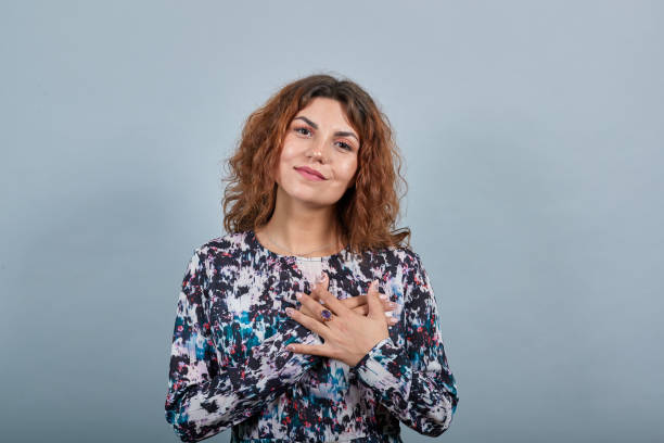 istock Unhappy lady keeping hands crossed on chest, looking directly, having nice ring 1202310273