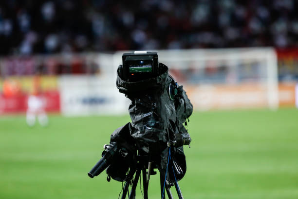 istock TV camera at the stadium, broadcasting during a football (soccer) match 1202314016