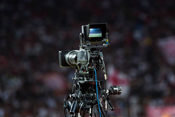 istock TV camera at the stadium, broadcasting during a football (soccer) match 1202314065