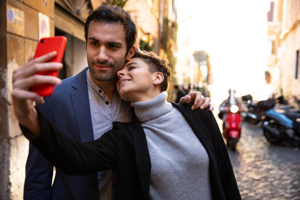 istock Romantic couple taking a selfie in Rome on vacation 1202315531