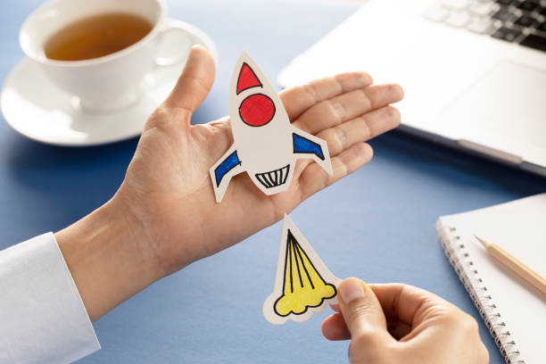 istock Business Person with Startup Rocket 1202318516