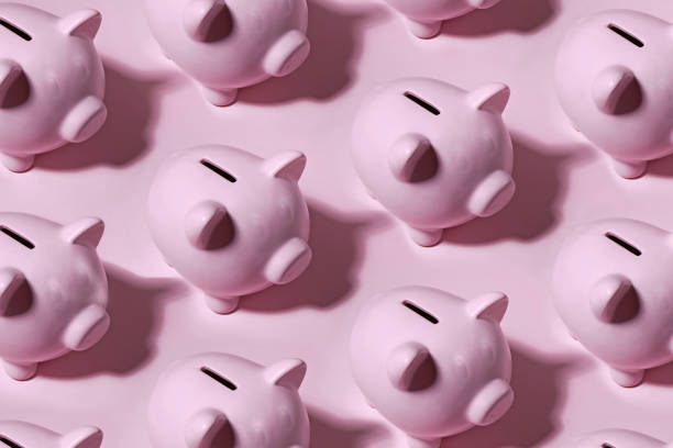 istock Piggy Bank on Pink Background 1202318946