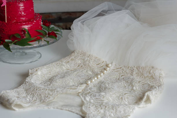 istock White wedding dress on the table 1202320681