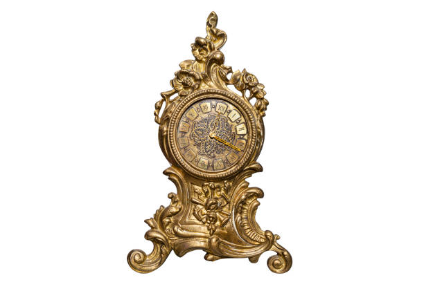 istock A large, standing clock made of brass with ornaments, isolated on a white background with a clipping path. 1202320834