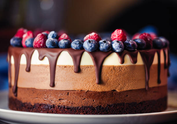 istock Beautiful fresh sweet cake with berry and chocolate 1202323843