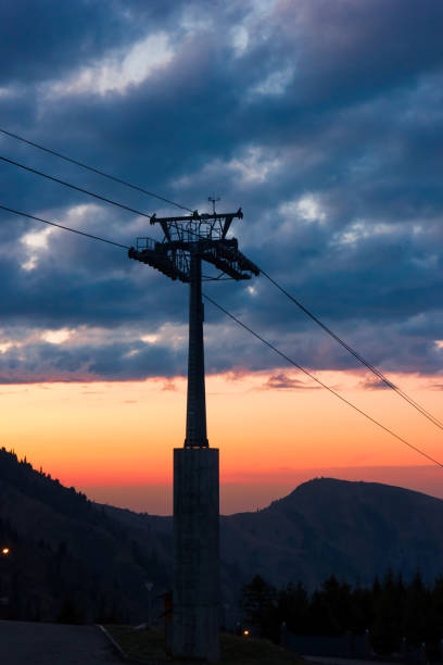 istock Mountain ski lift on sunset background 1202324152