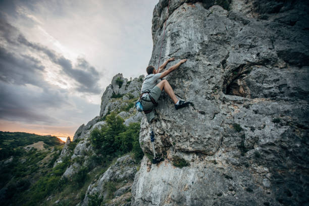 istock Disability man free rock climbing 1202326126