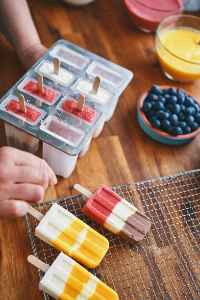 istock Preparing Mango, Strawberry, Chocolate, Yogurt Ice Cream on Stick 1202330482