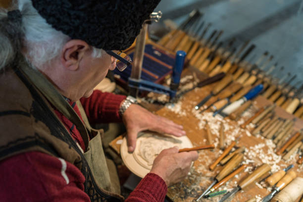 istock Senior male crafter working in his studio 1202330997
