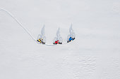 Aerial drone photo of a group of friends riding their fat bike in the snow in Ontario, Canada