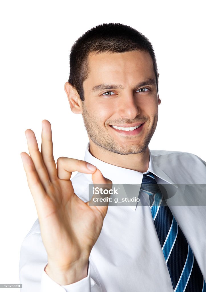 Heureux souriant jeune homme d'affaires avec le geste OK, isolé - Photo de Accord - Concepts libre de droits