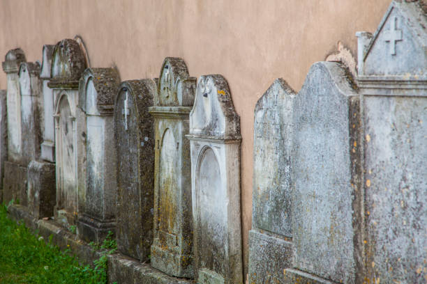 istock tombstones on the wall 1202333509