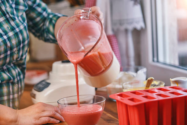 istock Preparing Strawberry Ice Cream on Stick 1202333516