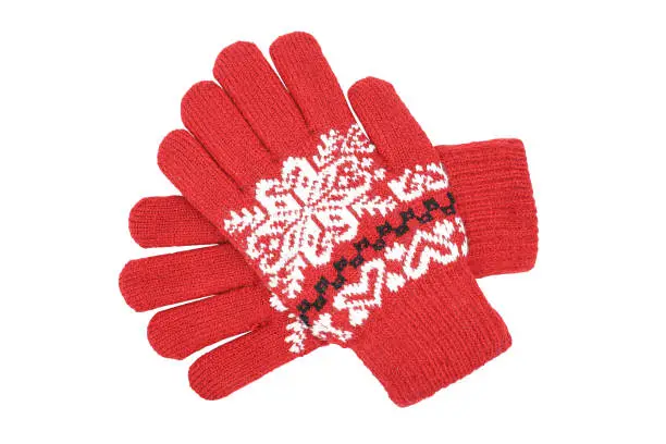 Photo of Red womens knitted wool winter gloves with pattern isolated on white background