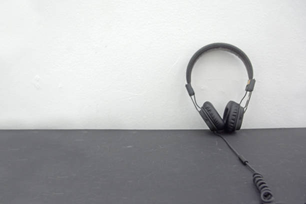 istock Headphone earpiece earphone on the floor 1202336832