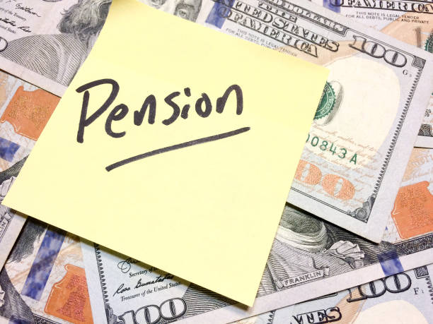 American cash money and yellow sticky note with text Pension American cash money and yellow sticky note with text Pension in black color aerial view philadelphia federal reserve stock pictures, royalty-free photos & images