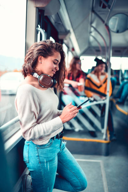 istock Female Setting Her Playlist During Bus Trip 1202338825