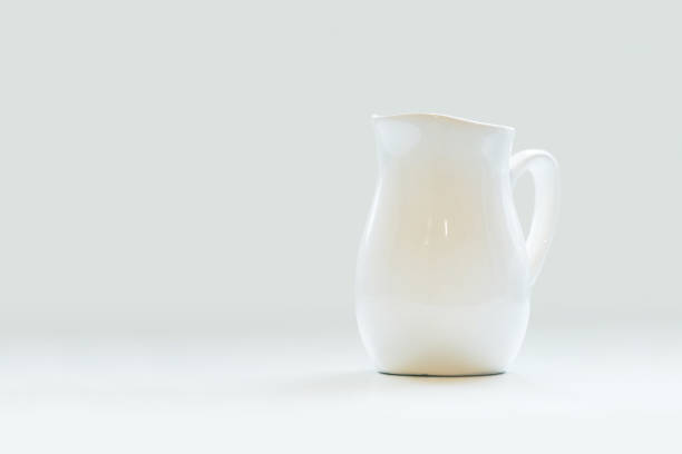 White porcelain milk jug on white background. Pitcher